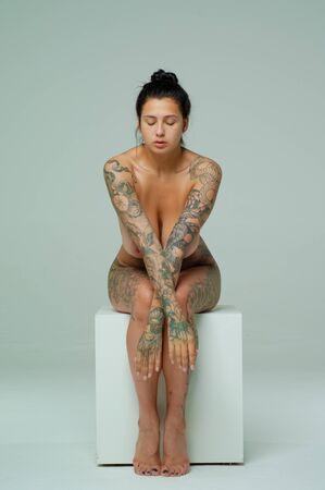 young beautiful girl posing nude in studioの写真素材
