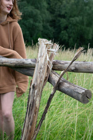 portrait of a girl in the village outside in a sweater in the summer in the fieldの写真素材