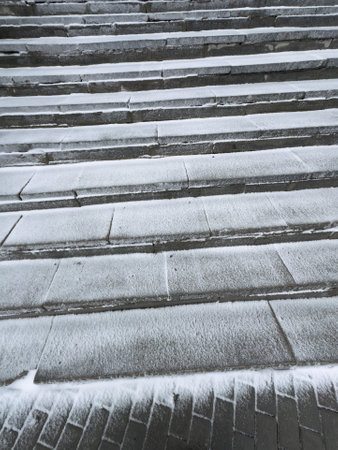Stairs covered with snow in the winter, closeup of photoの写真素材