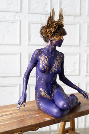 Beautiful young woman with a creative body painting. Body painting project.の写真素材