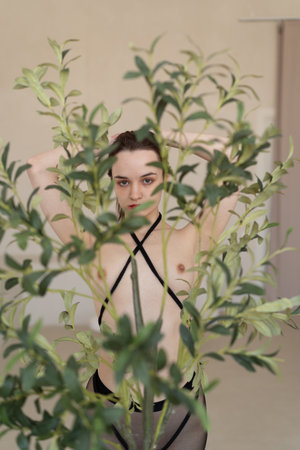 Portrait of a young woman in black lingerie.の写真素材