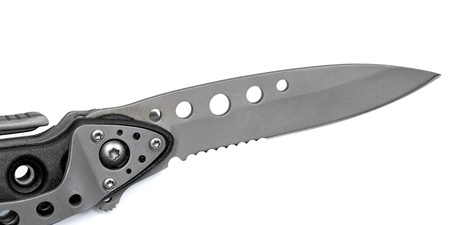 Close-up view to multifunction tool with opened knife on white background. Studio shot, not isolatedの写真素材