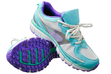 A pair of new girl sport indoor shoes, all logos and markings removed. Studio shot on white, not isolatedの写真素材