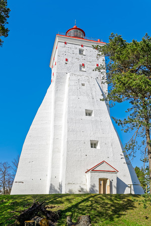 Big ancient tall white lighthouse in Kopu, Hiiumaa island, Moonsund archipelago, Estonia. One of the oldest lighthouses in the world, having been in continuous use since its completion in 1531のeditorial素材