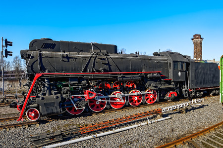 Old soviet freight steam locomotive series LV in railway station.のeditorial素材