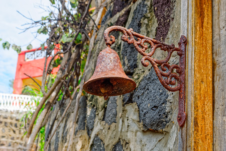 Old rusty bell on a wallの写真素材