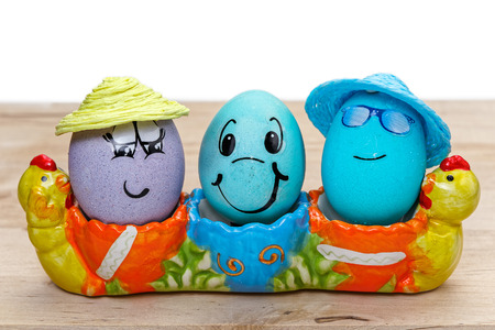 Eggs in the egg cup on wooden table