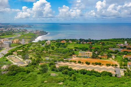 Aerial view to Dakar and shore of Atlantic ocean from observation deck of African Renaissance Monument through glassの写真素材