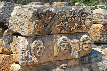 Close-up view to faces from ancient city Myra, Turkeyの写真素材
