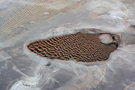 Water hole in formation of sea ice in Bohai Sea or Bo Sea, also known as Bohai Gulf or Bo Gulf,...