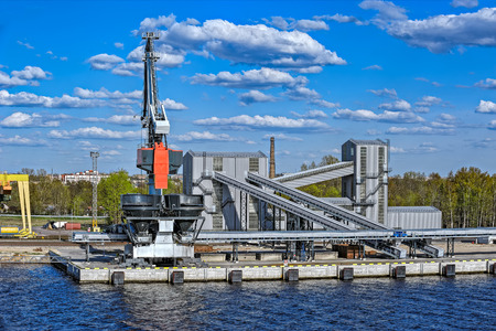 On-shore terminal with bulk cargo heavy duty equipment in Riga, Latvia