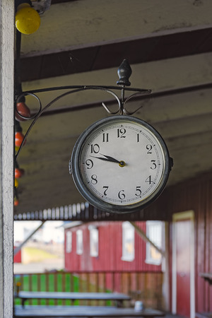 Clock in the local jetty pier pavilion. Hiiumaa island, Moonsund archipelago, Estonia.