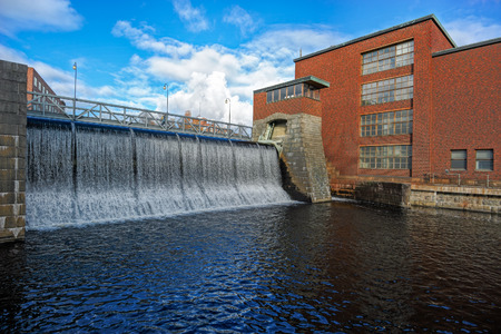 Water dam of old power plant on Tammerkoski river in Tampere, Finlandの写真素材