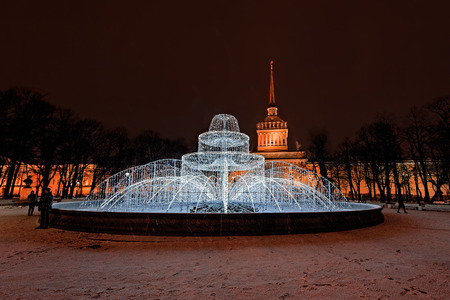 Electric winter fountain - decoration to Christmas and New Year with Admiralty building on backgroundのeditorial素材
