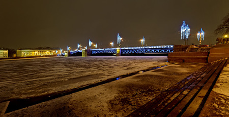 ST.PETERSBURG, RUSSIA - December 29, 2016: New Year and Christmas lighting decoration of the city -- Neva river embankment and Palace drawbridgeのeditorial素材