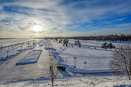 Parkland "Strelka" (Spit) at confluence of the rivers Volga and Kotorosl, place foundation of Yaroslavl and Monument to the 1000 anniversary of Yaroslavlat cold winter sunriseのeditorial素材