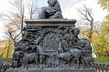 SAINT PETERSBURG, RUSSIA - October 20, 2016: Fragment of the pedestal of monument to Russian fabulist Ivan Krylov by sculptor Peter Klodt in the Summer Garden (Letniy sad) in Saint-Petersburgのeditorial素材