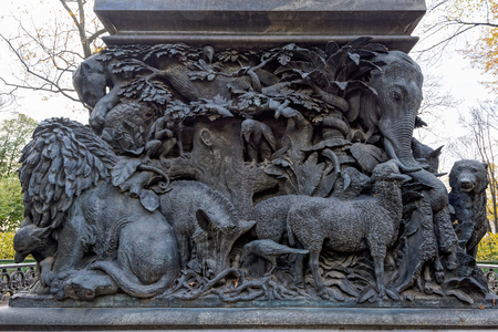 SAINT PETERSBURG, RUSSIA - October 20, 2016: Fragment of the pedestal of monument to Russian fabulist Ivan Krylov by sculptor Peter Klodt in the Summer Garden (Letniy sad) in Saint-Petersburgのeditorial素材
