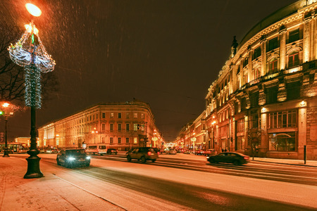 ST.PETERSBURG, RUSSIA - December 29, 2016: Beautiful night view of Nevsky Prospect near Palace Square in Saint Petersburg with snow blizzard and New Year and Christmas lighting decorationのeditorial素材