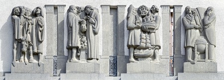 Allegorical sculptural group by Carl Milles on facade of current SEB headquarter, that show the development of the economy from simple trade to modern banking system.の写真素材