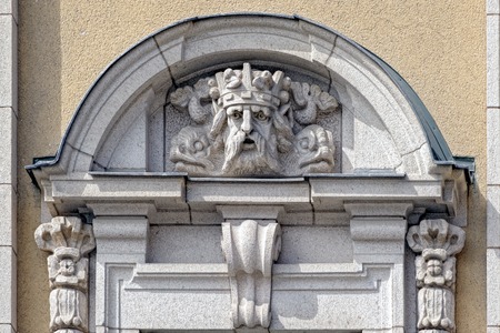 Mascaron on building on Gustav Adolfs Torg.