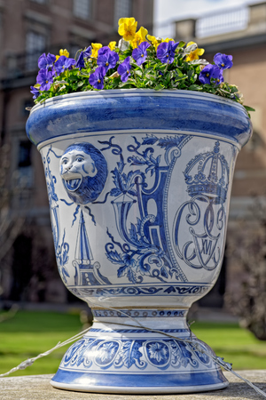 Flower pot outside the Royal castle in Stockholm with the insignia of the King Carl Gustaf XVI.のeditorial素材