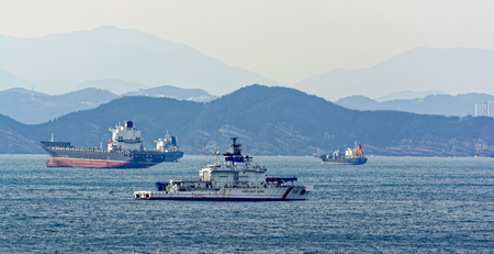 BUSAN, SOUTH KOREA - Jan 21, 2017: Korea coast guard boat patrolling coastline in Busan, South Korea.のeditorial素材