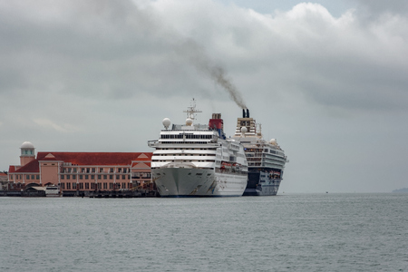 GEORGETOWN, MALAYSIA - Jan 02, 2017: Cruise passenger ship 'Superstar Gemini' berthed at Swettenham Pier in the Georgetown harbor. The ship was built in 1992 and owned and operated by Star Cruises.のeditorial素材