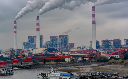 SHANGHAI, CHINA - Feb 21, 2017: Chinese Coast Guard (CCG) offshore patrol vessel No. 31088 berthed at the pier next to China's Biggest coal-fired power plant in Shanghai.のeditorial素材