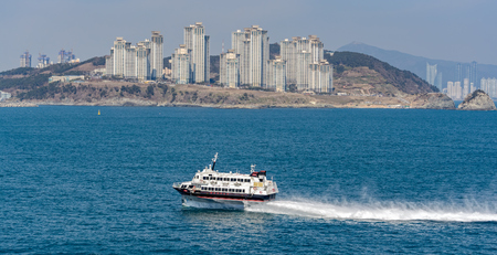 BUSAN, SOUTH KOREA - Feb 19, 2017: Passenger-carrying waterjet-propelled hydrofoil boat 'JR Beetle2 Jetfoil' (Boeing 929-117 by Kawasaki) in exciting trip from Fukuoka (Japan) to Busan (South Korea).のeditorial素材