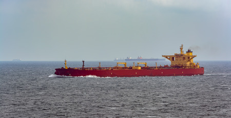 Crude Oil Tanker sailing through rough sea to Singapore strait.の写真素材
