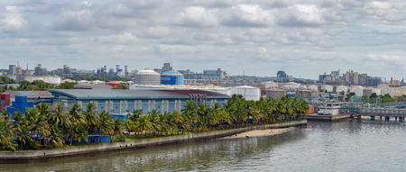 Panorama of industrial port in Pasir Gudang with cement and wheat bulk terminal and oil product tank...