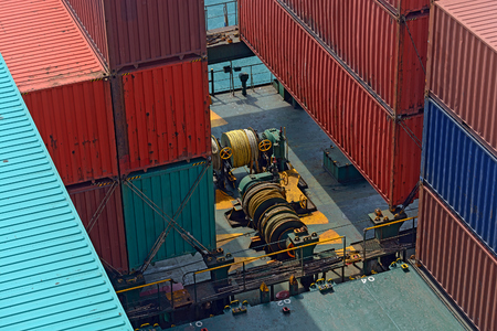 Marine mooring equipment on stern part of ship - large winches with hemp ropes and mechanisms of...