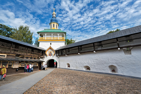 PECHORY, RUSSIA - Sep 17, 2017: The Petrovskaya Tower of The Holy Dormition Pskovo-Pechersky (Pskov-Caves) monastery with old orthodoxy gate icon from inner yard side.のeditorial素材