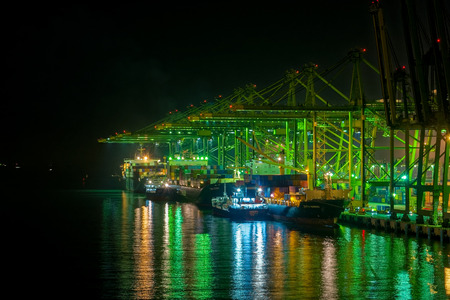 SINGAPORE, SINGAPORE - Sep 15, 2017: Night view of cargo operations in Singapore container terminal,...