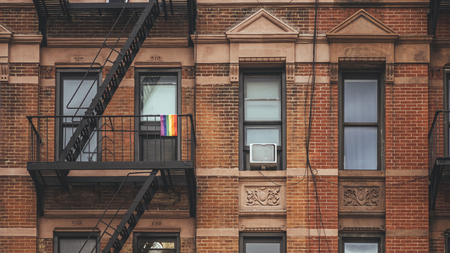 New York, USA / Rainbow flag at balconyの写真素材