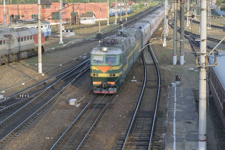 The passenger train arrives at the railway station.