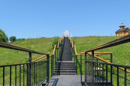 Metal stairs with railings leading up to the place of prayer