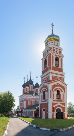 BOLHOV OF OREL REGION, RUSSIA - AUGUST 15, 2015: Trinity Church of brick against the blue cloudless...