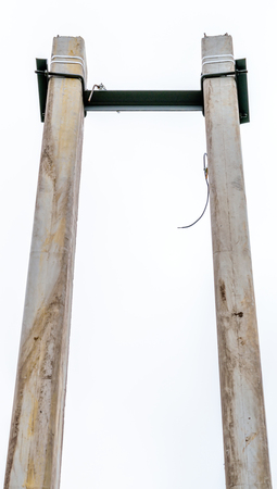 Bearing of power lines on two concrete pillars.の写真素材