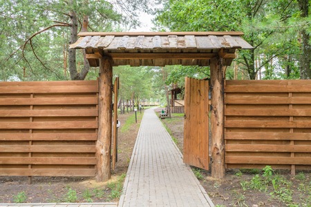 Wooden gate and fence at the entrance to the park