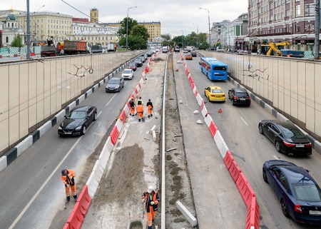 Moscow, Russia - July 14, 2016: Workers who produce renovation and repair of entry and exit road tunnelのeditorial素材