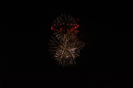 Holiday fireworks of colored lights isolated on the black background of the night sky.の写真素材