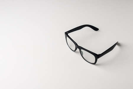 Black glasses on a white backgroundの写真素材