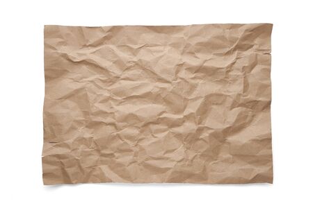 Wrinkled brown craft paper. Isolated sheet on white backgroundの写真素材