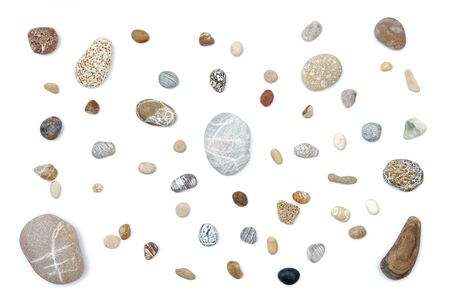 Mix of rounded multicolor textured stones. Isolated on white background flat layの写真素材