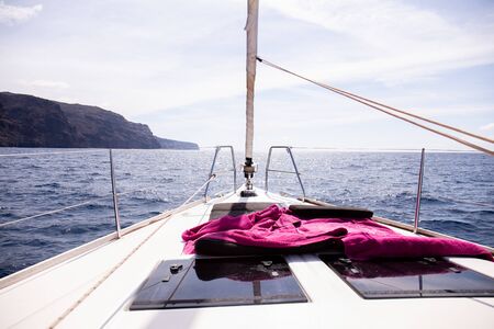 view from yacht at scenic rock in Atlantic ocean and blue sky in Maspalomas, Gran Canaria