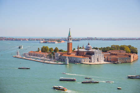 VENICE, ITALY - SEPTEMBER 9, 2019: San Giorgio Maggiore island and ships on water at sunny day in Venice, Italy.のeditorial素材