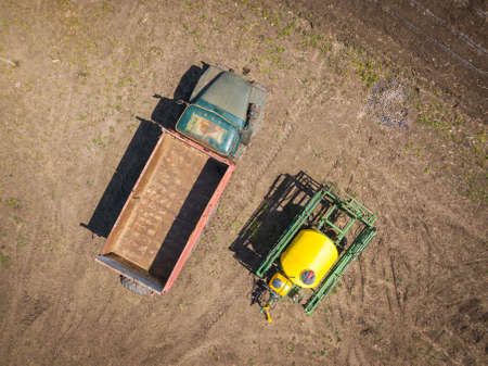 Aerial top down drone shot. Old truck and sprinkler.の写真素材