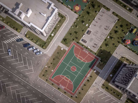 Aerial top down drone shot. Sport ground among the apartment complex.の写真素材
